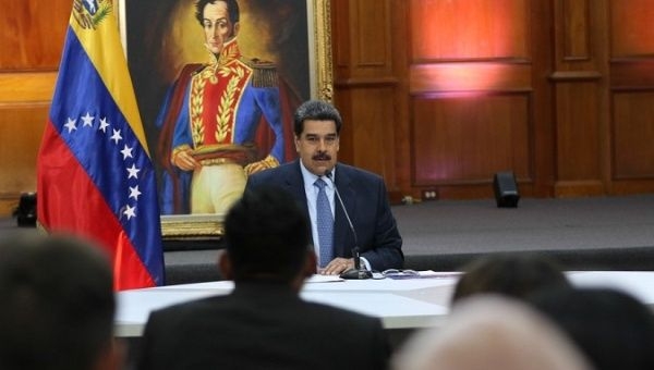 President Nicolas Maduro delivers a press conference to local and international media at the government's seat in Caracas. 