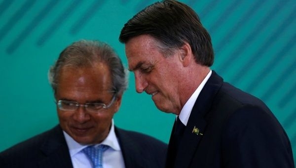 Brazil's President Jair Bolsonaro and Economy Minister Paulo Guedes attend a ceremony at the Planalto Palace in Brasilia, Brazil January 7, 2019.
